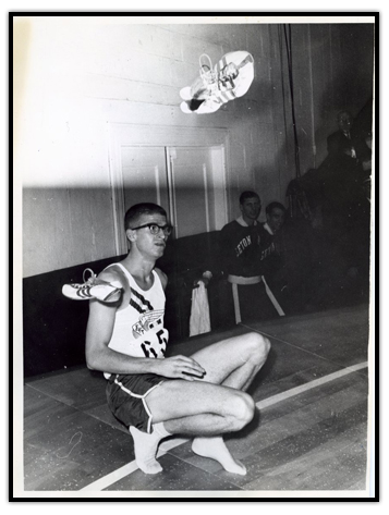 Bill Crothers crouched on the floor