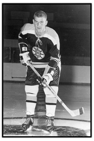 Bobby Orr posing on the ice with his stick