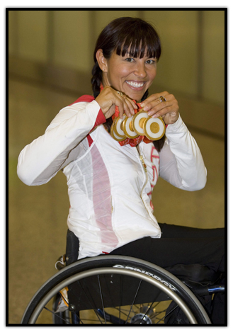 Chantal Petitclerc shows off her five Gold medals