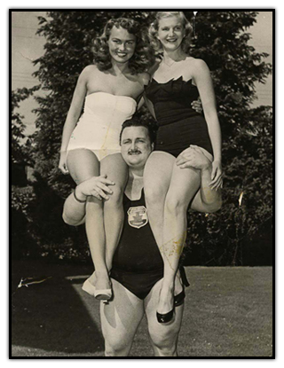 Doug Hepburn lifts two women simultaneously