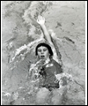 Elaine Tanner swimming on her back