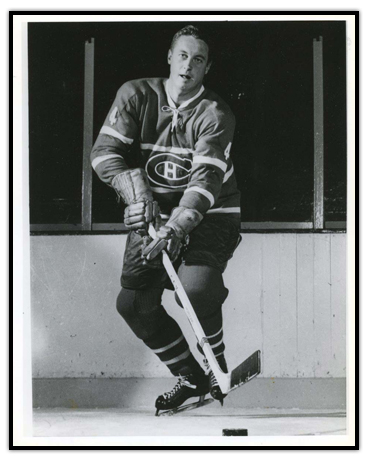 Jean Beliveau on the ice with the puck