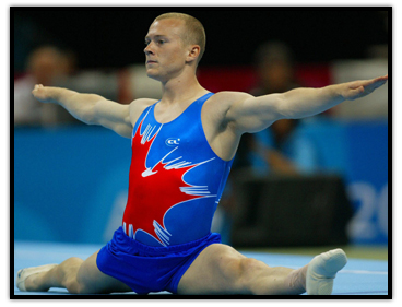 Kyle Shewfelt does the splits during a floor routine