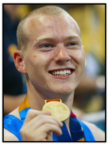 Kyle Shewfelt shows his Gold medal
