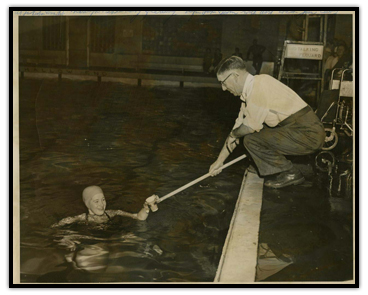 Marilyn Bell receiving a drink
