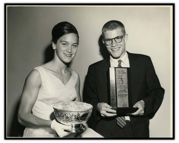 Mary Stewart (Left) and Bruce Kidd holding their trophies