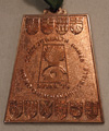 Nancy Garapick wins an isosceles trapezoid shaped medal.