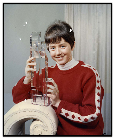 Nancy Greene holding a trophy