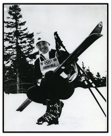 Nancy Greene posing in her Olympic skiing uniform