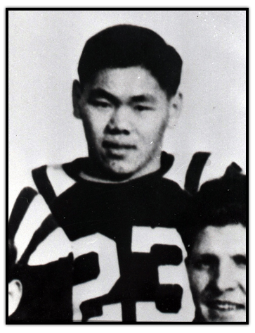 Normie Kwong in a football uniform wearing number 23