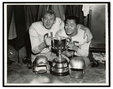Jackie Parker and Normie Kwong (right) celebrating with the Grey Cup