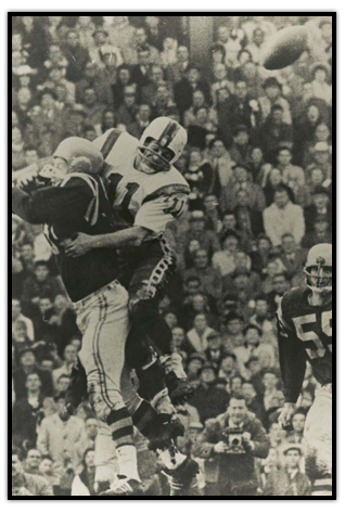 Ron Stewart tackling a player