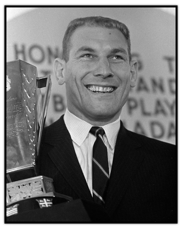 Russ Jackson celebrates with the Schenley Trophy