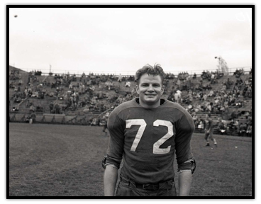 Tony Golab standing on a football field without his helmet
