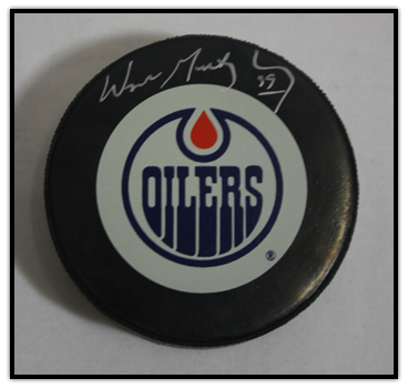 Puck signed by Wayne Gretzky